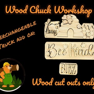 May include: Wooden cutouts for a craft project. The cutouts include a beehive, a bee, a sign that says "Bee Kind", and a sign that says "Buzz". The cutouts are made of unfinished wood and are ready to be painted or stained.