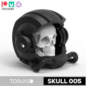 May include: A black helmet with a skull inside. The helmet has a striped design and a visor that is partially open. The skull is white and has a detailed design. The helmet has a label that says "TORUA3D" and "SKULL 005".