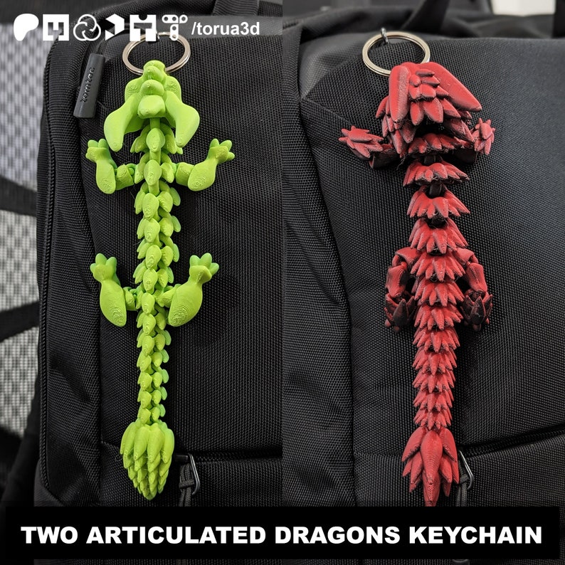 May include: Two articulated dragon keychains. One is lime green, the other is red. Both are attached to silver keyrings. The dragons are 3D printed and have a segmented design. The text at the bottom reads "TWO ARTICULATED DRAGONS KEYCHAIN".