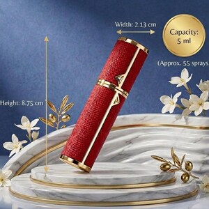 May include: A red, textured perfume atomizer with gold accents. The atomizer is 8.75 cm tall and 2.13 cm wide, with a capacity of 5 ml (approx. 55 sprays). The design includes gold trim and a decorative gold element.