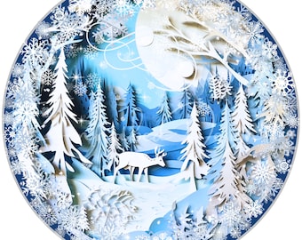 May include: A white paper cut-out of a winter forest scene with a deer in the foreground. The scene is surrounded by a blue circle with white snowflakes.