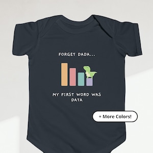 May include: A dark blue baby onesie with a graphic of a bar chart and a dinosaur. The text on the onesie reads "Forget Dada... My first word was DATA".