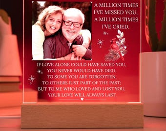 May include: A red illuminated acrylic plaque with a photo of a couple and a message that reads: "A million times I've missed you, a million times I've cried. If love alone could have saved you, you never would have died. To some you are forgotten, to others just part of the past; but to me who loved and lost you, your love will always last."