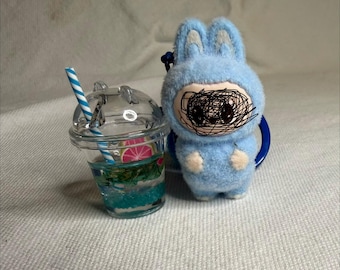 Fuzzy Kawaii monster keychain with drink charm