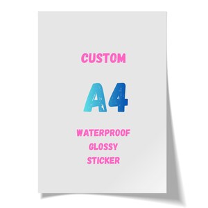 May include: A white sticker with the words "CUSTOM" in pink, and "A4" in blue. Below the "A4" text are the words "WATERPROOF", "GLOSSY", and "STICKER" in pink. The sticker has a glossy finish.