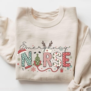 Sweat-shirt de Noël d'infirmière des urgences, chemise mignonne d'infirmière d'urgence, cadeau saisonnier d'infirmière de Noël aux services d'urgence, pull d'infirmière joyeuse