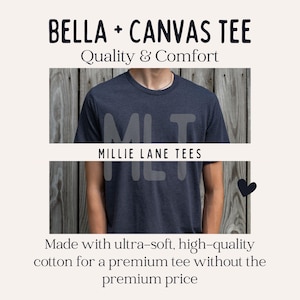 May include: A navy blue Bella + Canvas tee shirt with the text "MLT" and "MILLIE LANE TEES" printed on the front. The image also includes the text "Quality & Comfort" and "Made with ultra-soft, high-quality cotton for a premium tee without the premium price."