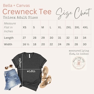 May include: A Bella + Canvas crewneck tee size chart for unisex adult sizes. The chart displays length and width measurements in inches for sizes XS through 4XL. A dark gray t-shirt, blue denim shorts, and tan sandals are shown below the chart.