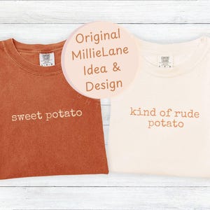 May include: Two Comfort Colors t-shirts, one in burnt orange and one cream. The burnt orange shirt says "sweet potato" in brown. The cream shirt says "kind of rude potato" in brown.