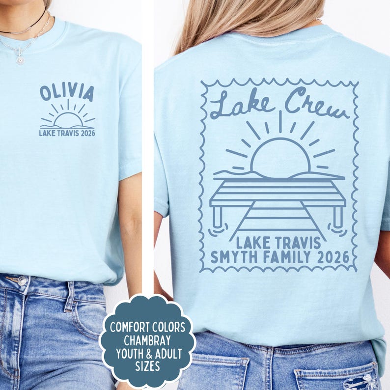 May include: A light blue t-shirt featuring a dark blue graphic. The front chest displays the name OLIVIA above a sun and the text LAKE TRAVIS 2026. The back features a large stamp-shaped design with a dock, sun, and text LAKE CREW SMYTH FAMILY 2026.