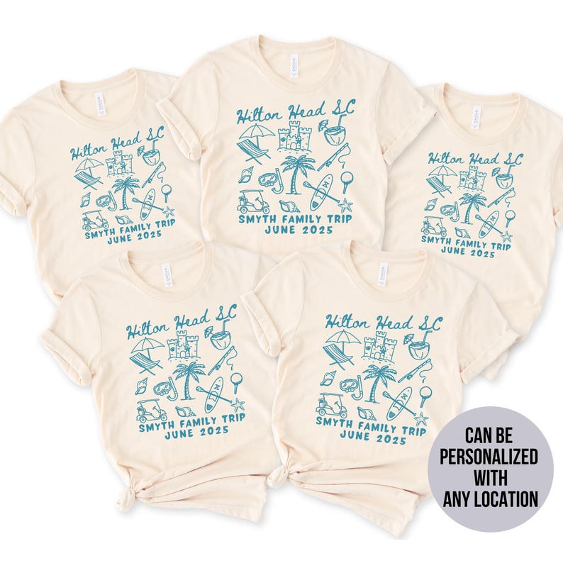 May include: Four beige t-shirts with a blue graphic design of a palm tree, beach umbrella, beach chairs, and other beach-related items. The text "Hilton Head SC" and "Smyth Family Trip June 2025" is printed on each shirt.