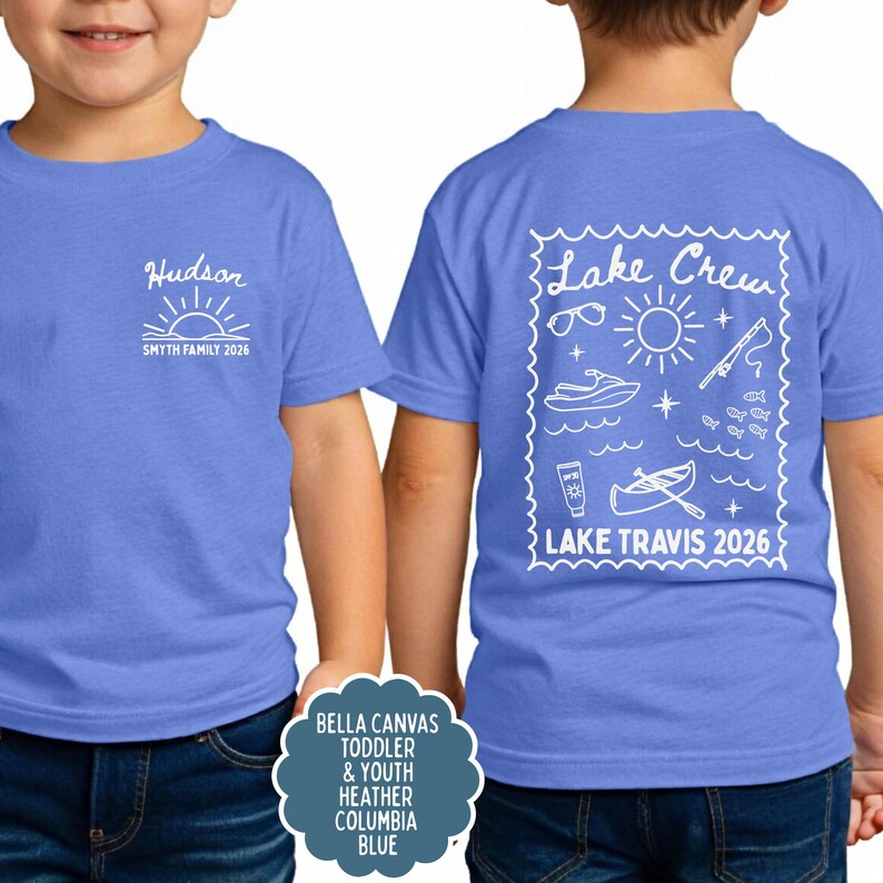 May include: A blue t-shirt with white graphics. The front features the name "Hudson" above a sun design and "SMYTH FAMILY 2026". The back has a "Lake Crew" design with lake-themed icons and "LAKE TRAVIS 2026".