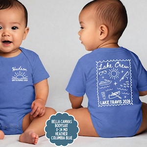 May include: Two babies wearing blue bodysuits. One bodysuit has the name "Hudson" and "SMYTH FAMILY 2026" printed on the front. The other has "Lake Crew" and "LAKE TRAVIS 2026" with lake-themed graphics on the back. The bodysuits are Columbia Blue.