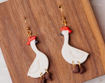 Goose in boots dangle earrings handmade with polymer clay.
