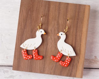 Ducks in boots dangle earrings handmade with polymer clay.