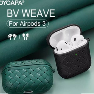 May include: Two woven Airpods 3 cases, one green and one black. The cases have a woven pattern and are designed to protect the Airpods 3. The text "BV WEAVE" and "For Airpods 3" is displayed above the cases.