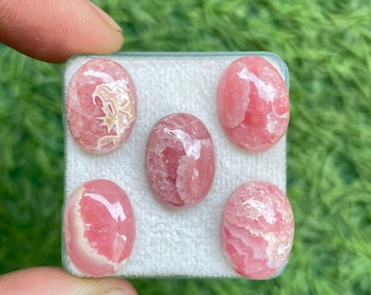 Rodocrosite naturale, grado AAA, forma ovale, cabochon calibrato con retro piatto, gemma disponibile nelle dimensioni 10 x 14 mm