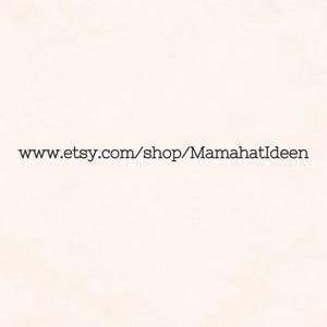 May include: Text on a cream-colored background reads "www.etsy.com/shop/MamahatIdeen" in a simple, dark font. The text is centered, and the background is a solid, neutral color.