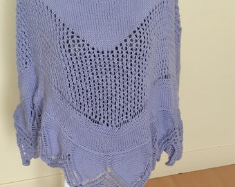 a hand-knitted sky blue poncho