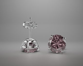 May include: A pair of silver stud earrings with a round, faceted, purple gemstone in each earring.