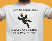 Personalized Funny BBQ Gift T-Shirt, [NAME] Likes To Smoke Food It Gives Him A Reason To Play With Fire, Gift For Men, Gift For Dad