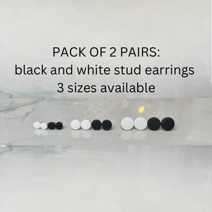 May include: Pack of two pairs of black and white stud earrings. Three sizes available.