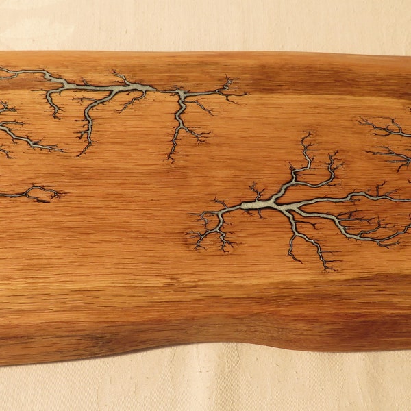 Lovely oak serving board with white resin fractal pattern.