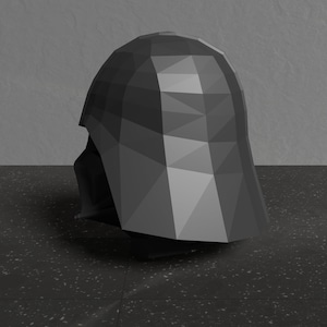 May include: A black, low-poly, 3D model of a Darth Vader helmet. The helmet is angled to the side, showing the left side of the helmet.
