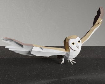 May include: A white and brown origami barn owl with its wings spread out. The owl is perched on a black surface.