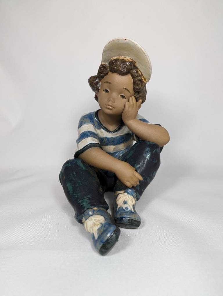 Sold at Auction: Retired Lladro Boy & Girl Porcelain Figurine 2173