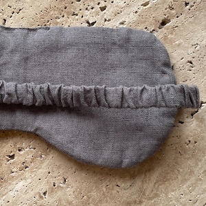 Mellby Atelier linen sleep mask in charcoal, closeup of the back showing the soft elastic head band.