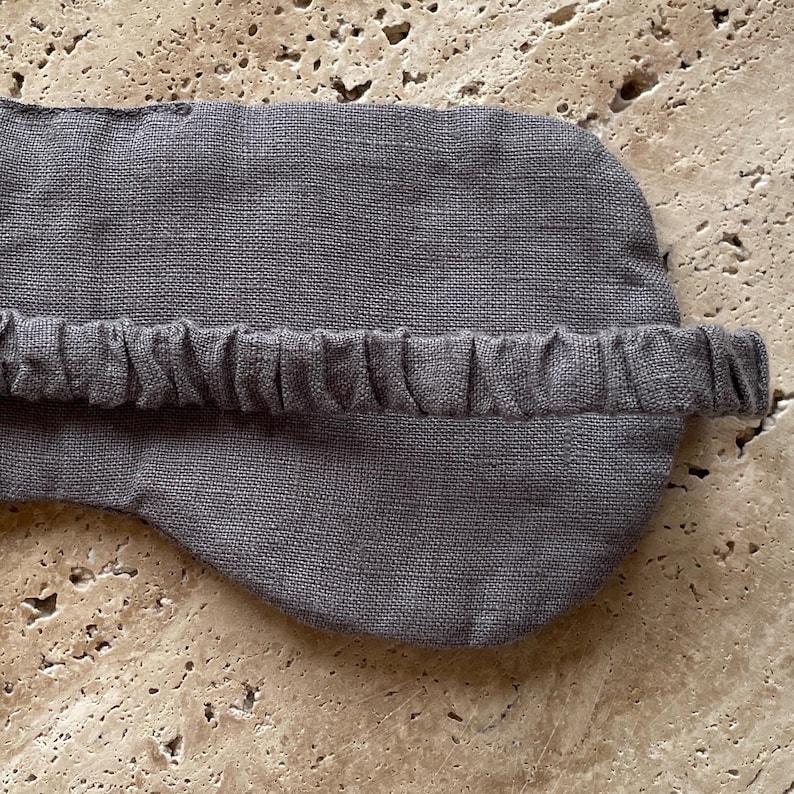Mellby Atelier linen sleep mask in charcoal, closeup of the back showing the soft elastic head band.