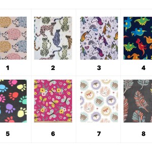 May include: A grid of eight fabric swatches featuring various patterns: hedgehogs, leopards, unicorns, dinosaurs, colorful paw prints, butterflies with flowers, woodland animal faces in circles, and feathers on a dark background, numbered one through eight.