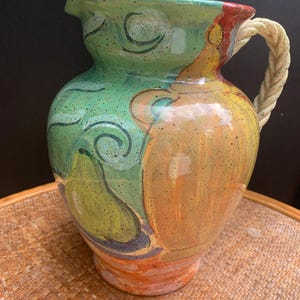 May include: A rustic wooden sign with the text "Welcome to our home" in white lettering. The sign features a distressed finish and a simple, inviting design, perfect for front door decor.