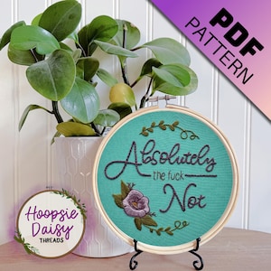 Op de afbeelding: Geborduurde hoepelkunst met de tekst "Absolutely the fuck Not" in donkerpaars garen op een turquoise achtergrond. Het ontwerp bevat een paarse bloem en groene bladeren. De tekst "PDF PATTERN" staat rechtsboven.