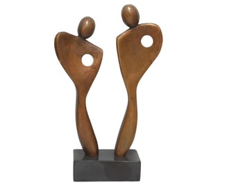 Eternal Harmony: Bronze Couple Sculpture for the Eighth Wedding Anniversary. Brown and gold statue on black marble base