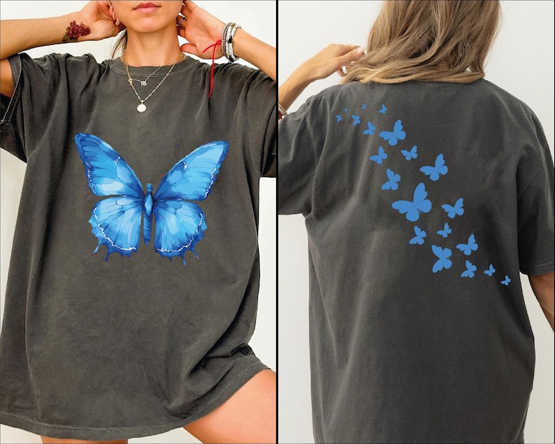 a woman wearing a blue butterfly t - shirt