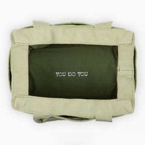 light green pottery and art supply bag