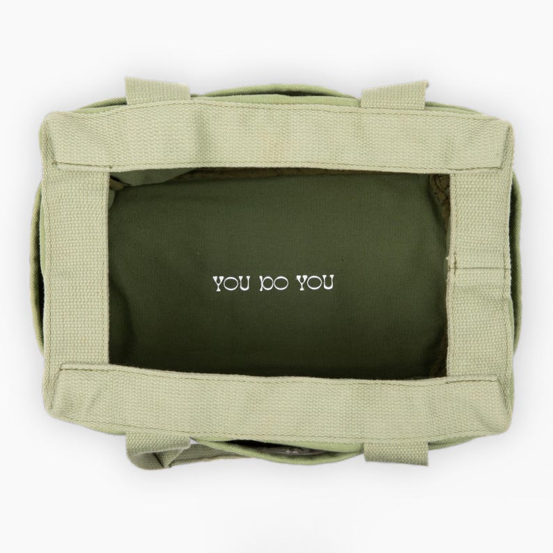 light green pottery and art supply bag