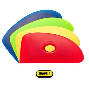 May include: A stack of four colorful pottery rib tools in blue, green, yellow, and red. The red tool has the text "MUDTOOLS" and "SHAPE 4" is in a yellow box.