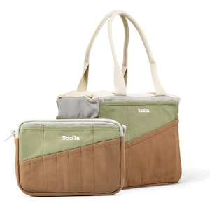 May include: A tote bag and matching pouch set. The bags are color-blocked with olive green, brown, and gray panels. The tote bag has cream-colored handles. The word "Sooila" is embroidered on both bags.