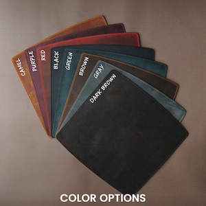 May include: A selection of leather swatches in various colors, including camel, purple, red, black, green, brown, gray, and dark brown. The swatches are arranged in a fan shape with the color names written on each swatch. The text "COLOR OPTIONS" is written below the swatches.