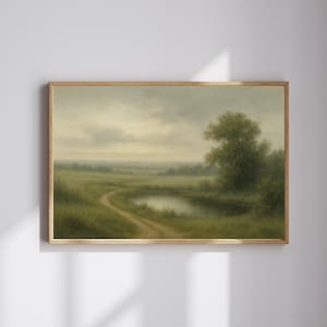 May include: A framed landscape painting depicts a serene countryside scene. A dirt path curves through a green field towards a small pond. The sky is overcast, and a large tree stands on the right side of the painting.