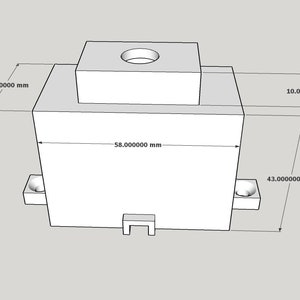 Op de afbeelding: Een witte rechthoekige doos met een kleinere witte doos erop. De doos heeft afmetingen van 14,7 cm bij 10,9 cm bij 7,9 cm.
