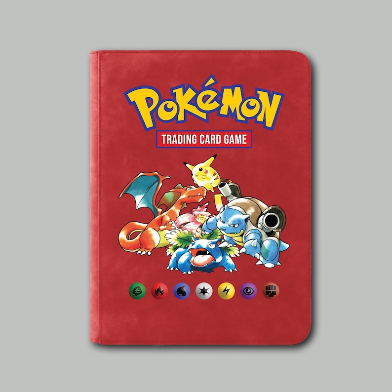 May include: Red Pok&eacute;mon trading card binder with the Pok&eacute;mon logo and "Trading Card Game" text. The cover features various Pok&eacute;mon characters, including Charizard, Pikachu, and Blastoise. The binder has a row of colorful icons at the bottom.