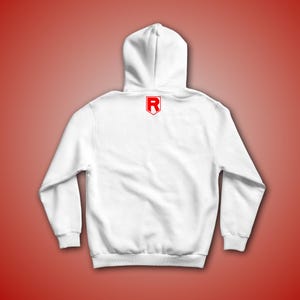 May include: White hooded sweatshirt with a red letter "R" in a shield shape on the back.