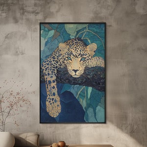 May include: A framed print of a leopard lying on a branch in a jungle setting. The leopard has a blue and yellow patterned coat and is looking directly at the viewer. The background is a blue and green watercolor wash.