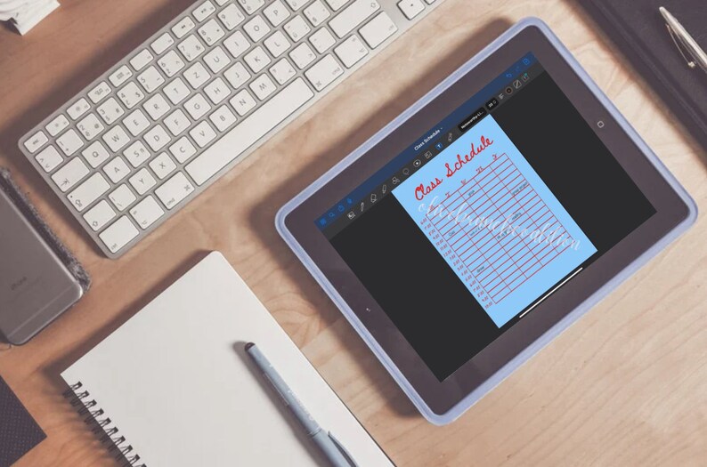 May include: A blue tablet with a white border displaying a light blue sheet of paper with a red handwritten title "Class Schedule". The paper has a grid with columns for days of the week and times of day.