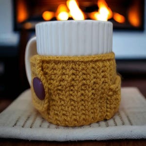 Handknitted Cup Cozy /  Mug Cover with a pouch  for your tea bags and a button