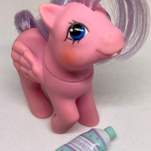 Vintage “Baby North Star” Hasbro My Little Pony G1 Baby Pony Pegasus with First Tooth and toothpaste accessory. Non Beddy Bye Eye. 1987.